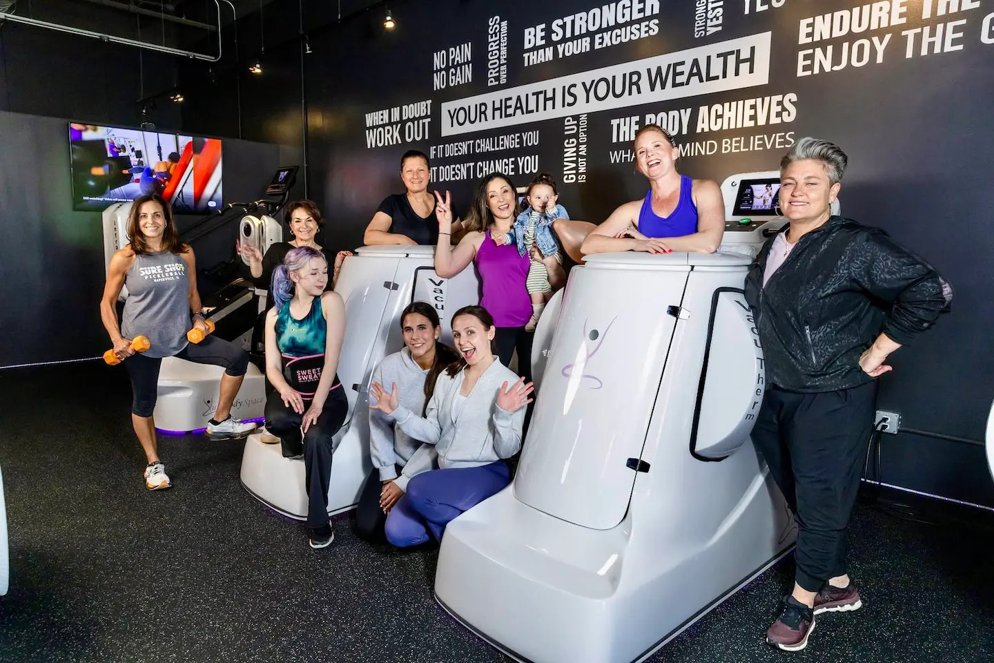 Lux Body Space team and clients in the women's wellness studio in Wheaton, IL