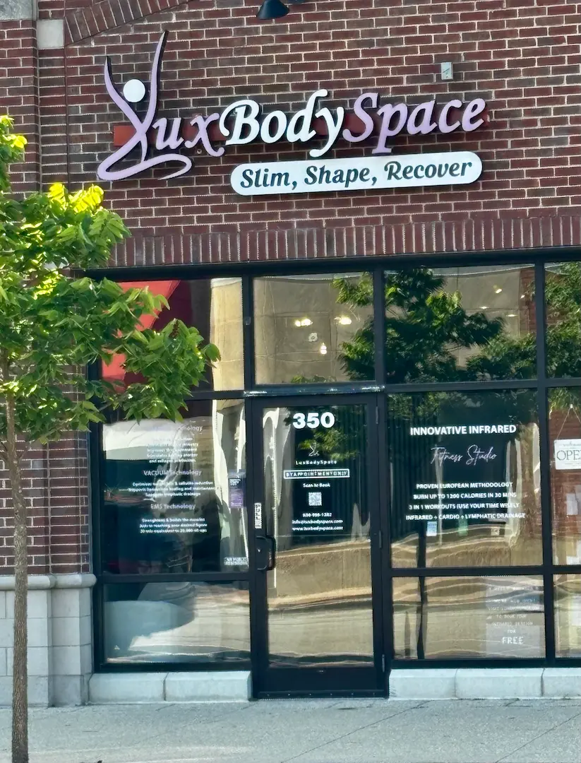 Lux Body Space storefront entrance on a brick street in Downtown Wheaton