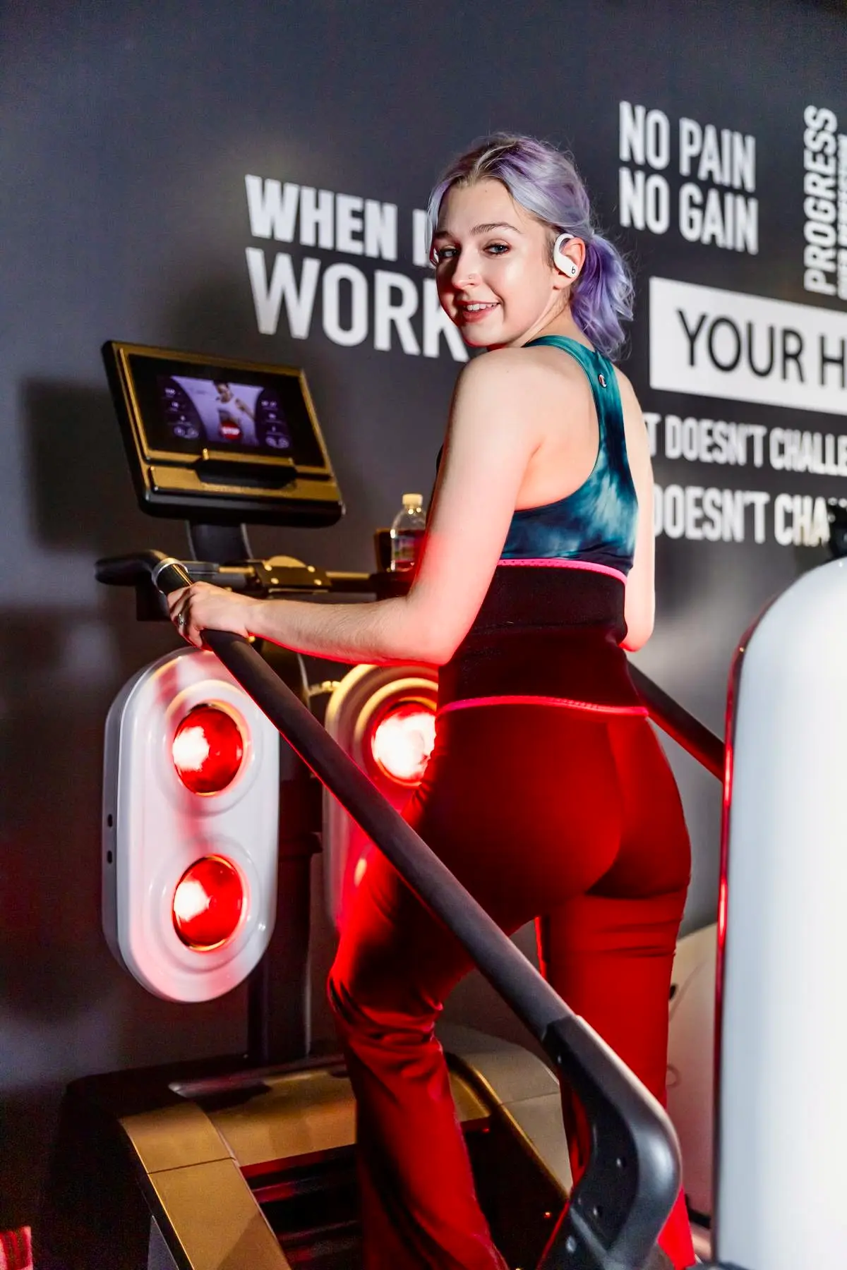 Woman working out on the infrared climber at Lux Body Space