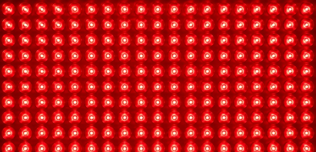 Red light therapy panels glowing at Lux Body Space